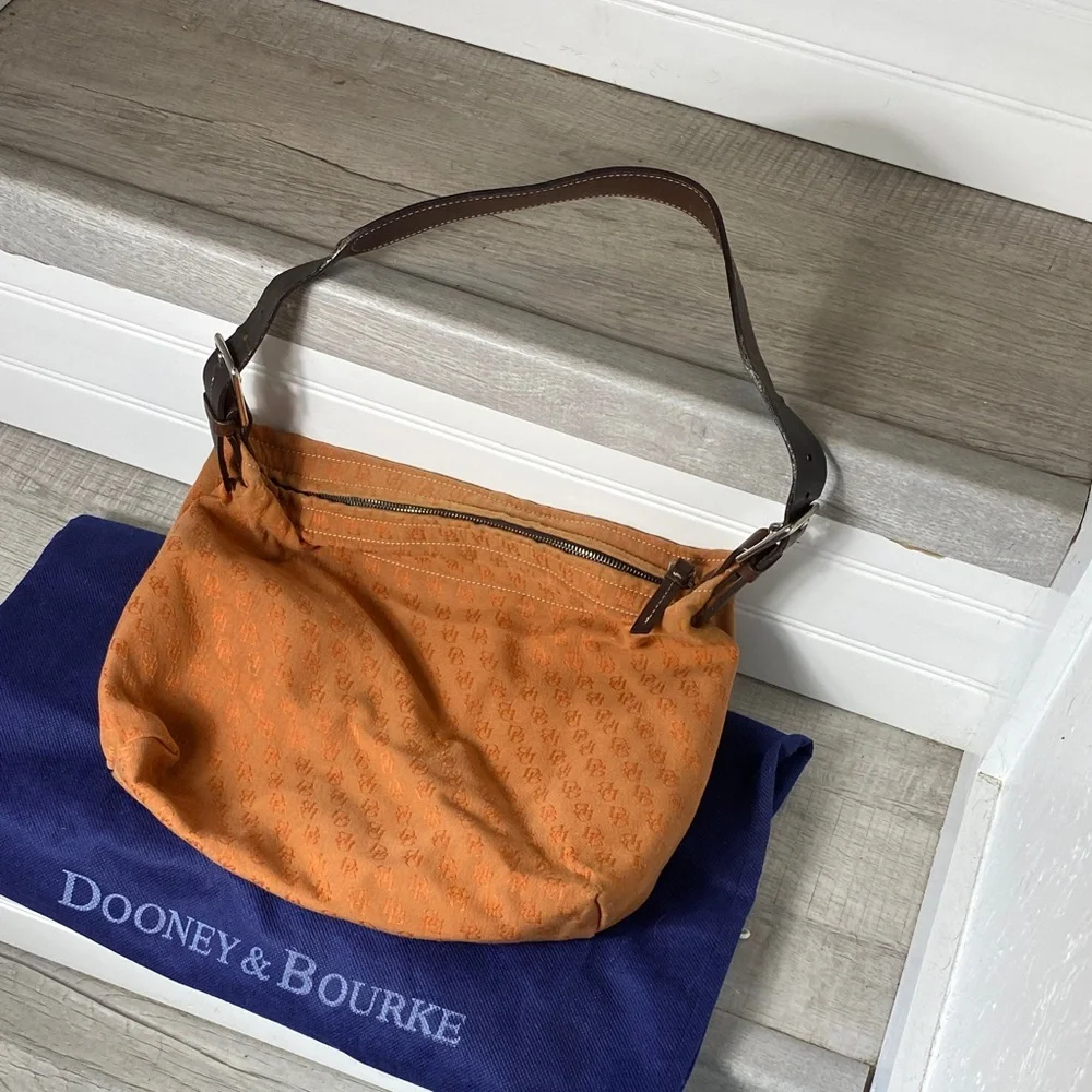 Dooney & Bourke Vintage burnt Orange over the shoulder bucket Bag